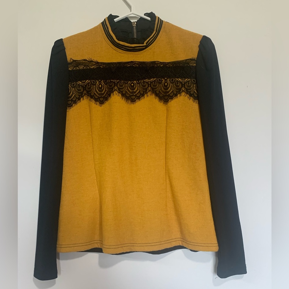Size medium yellow shirt with lace detail.